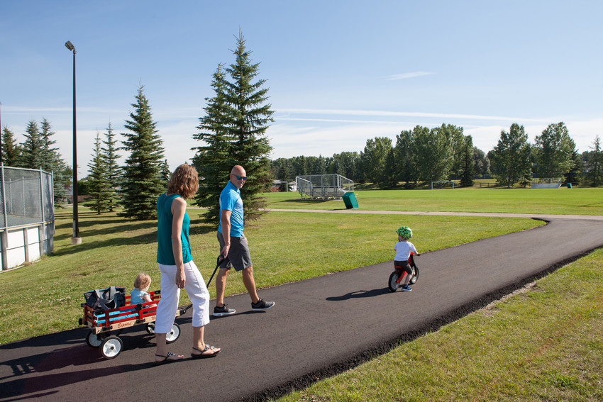 Family walking through a park